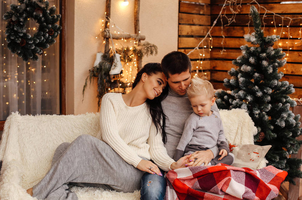 beautiful happy family celebrating Christmas at cozy decorated h - Foto, afbeelding