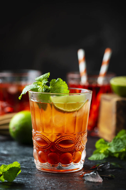 Red fresh cocktail with ice and lime - Фото, зображення