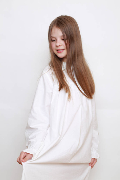 Caucasian beautiful kid in nightwear - Fotó, kép