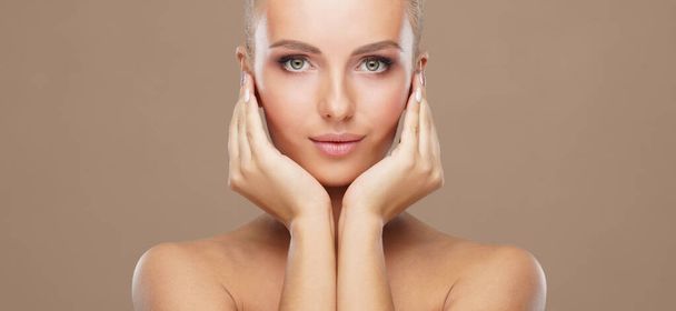 Beautiful face of young and healthy woman. Skin care, cosmetics, makeup, complexion and face lifting concept. - Photo, Image