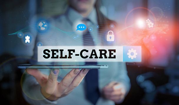 Conceptual hand writing showing Self Care. Business photo text practice of taking action to preserve or improve ones own health Picture photo network scheme with modern smart device. - Photo, Image