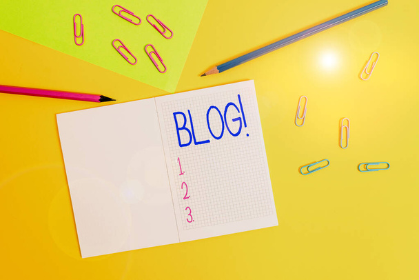 Writing note showing Blog. Business photo showcasing regularly updated website web page run by individual Blank squared notebook pencils markers paper sheet colored background. - 写真・画像