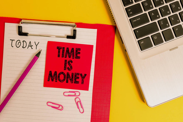 Conceptual hand writing showing Time Is Money. Business photo text time is a valuable resource Do things as quickly as possible Metallic laptop clipboard paper sheet pencil colored background. - 写真・画像