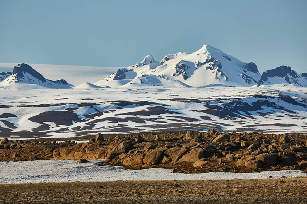 Iceland landscape with snow on mountains - Fotoğraf, Görsel