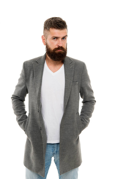 Owner of brutal beard. Caucasian man with brutal appearance. Bearded man with moustache and beard on unshaven face in brutal style. Brutal hipster wearing casual outfit - Фото, изображение