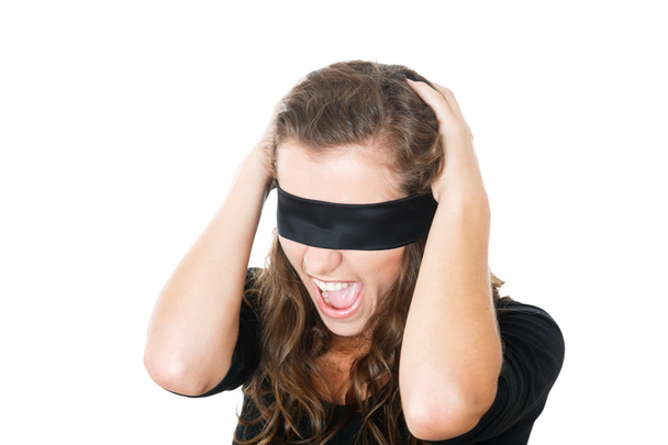 geschokt jonge vrouw met blinddoek - Foto, afbeelding