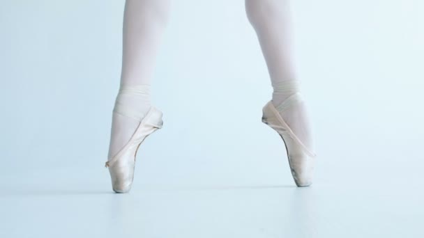 Feet ballerina closeup, stands on toes, performs elements of ballet - Кадри, відео