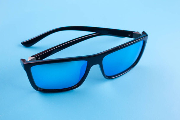 Sunglasses on blue background - Foto, immagini