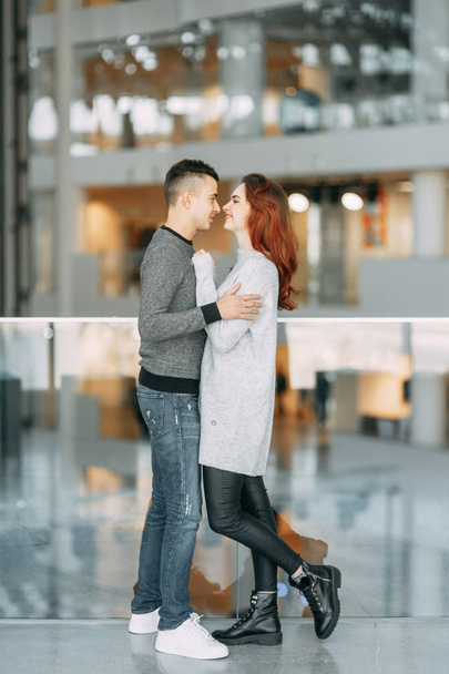 Bright emotions and laughter of loving people. Couple's photo shoot at the Mall.  - Fotografie, Obrázek