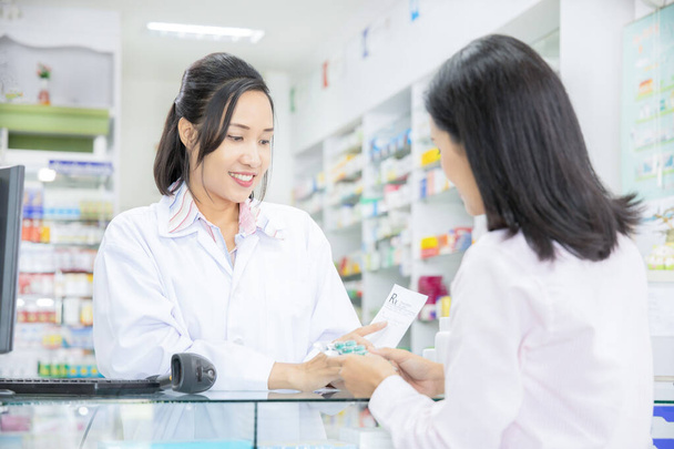 pharmacist  working in drugstore - Photo, Image