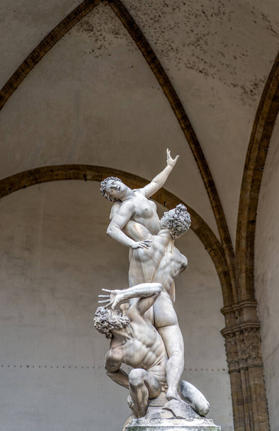 Florence, Italy - August 26, 2018: Statue sculpture Giambolognas Sabine Women in Piazza della Signoria - Фото, изображение