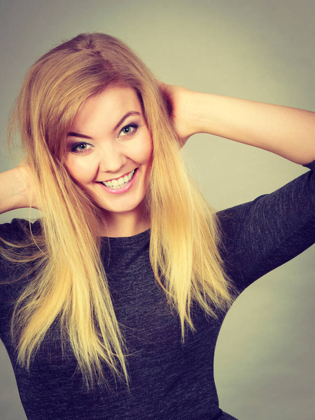 Portrait of happy blonde woman smiling with joy - Foto, Bild