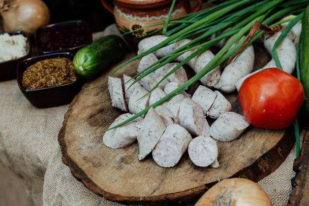 village table boiled white sausage - Foto, afbeelding