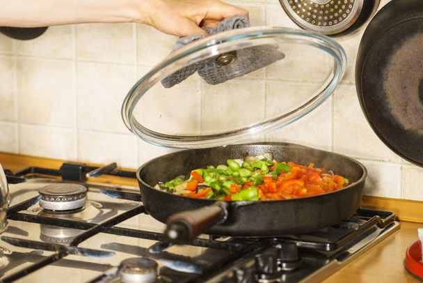 Chopped vegetables on frying pan - Foto, Imagen