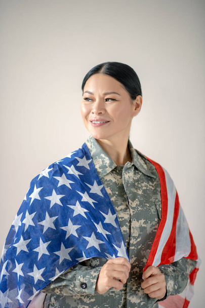 Beautiful woman feeling proud celebrating Independence day - 写真・画像