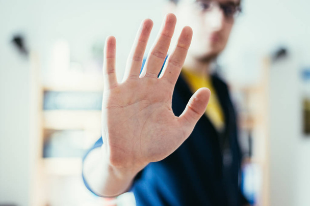 Defense or stop gesture: Male hand with stop gesture - Zdjęcie, obraz