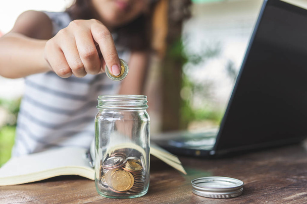 Businesswomen Put the coin in a glass jar To save money, save mo - Photo, Image