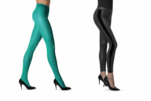 Two beautiful sexy girls in nylon turquoise tights and black leggings and high heels posing isolated on white background. Women in hosiery - Photo, Image