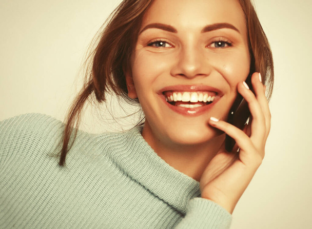  beautiful cheerful woman talking on mobile phone - Fotó, kép