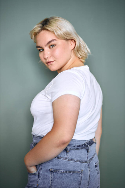 portrait of beautiful plus size young blond girl posing isolated - Φωτογραφία, εικόνα