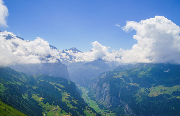 Alpine peaks landscape background. Lauterbrunnen, Jungfrau, Bernese highland. Alps, tourism journey hiking concept - Foto, afbeelding