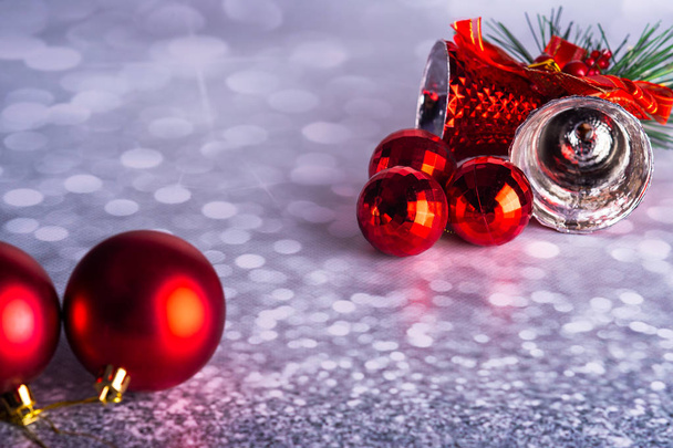 Christmas bell with red balls on a gray background - Photo, Image