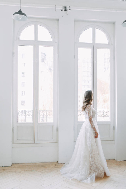 Beautiful girl in white dress, European wedding. Air and light photo shoot of the bride.  - Photo, Image