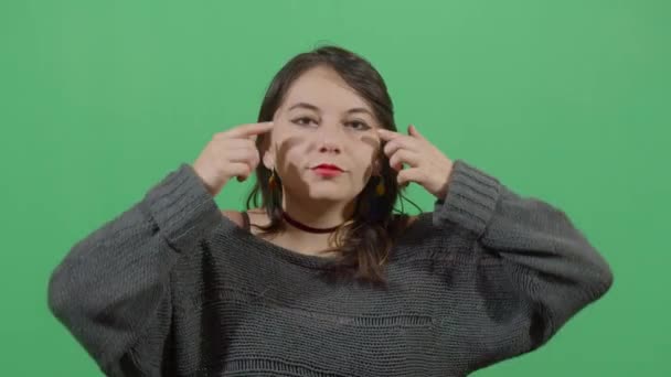 Woman Making Asian Eyes With The Fingers - Filmagem, Vídeo