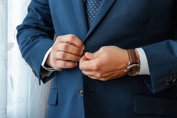 Hands of a businessman, close-up, buttons on a jacket. Concept of business style. - Foto, Imagem