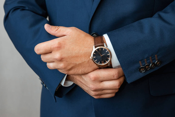 Hands of a businessman, close-up, buttons on a watch - Fotografie, Obrázek