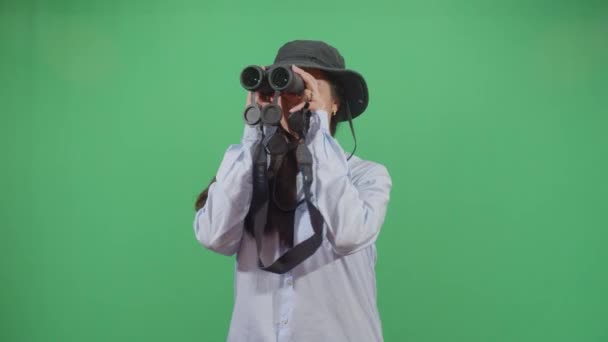 Woman Explorer Chasing With Binoculars - Кадры, видео