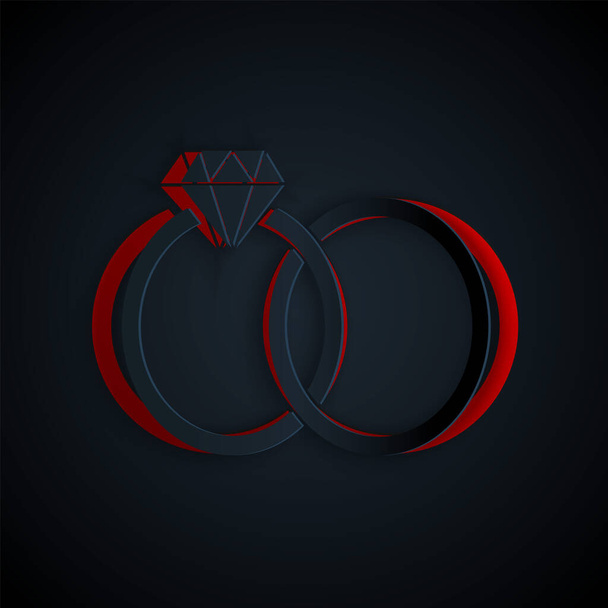 Řez papíru Svatební kroužky ikona izolované na černém pozadí. Šperk nevěsty a ženicha. Ikona manželství. Diamantový prsten. Papírový styl. Vektorová ilustrace - Vektor, obrázek