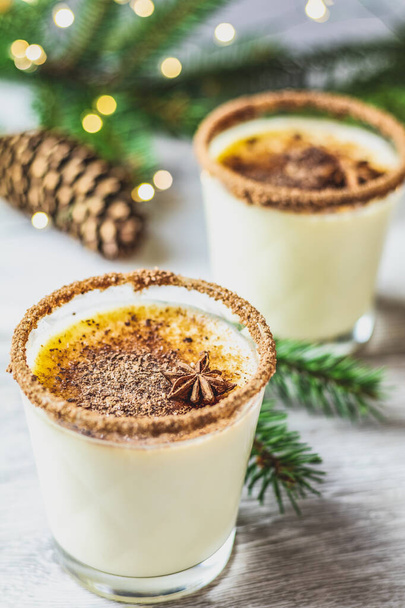 Eggnog with cinnamon and nutmeg for Christmas and winter holiday - Photo, Image