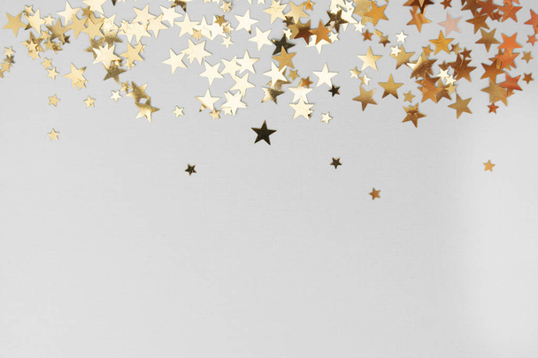 Abstract Christmas background with golden glitter over white board. - Foto, afbeelding