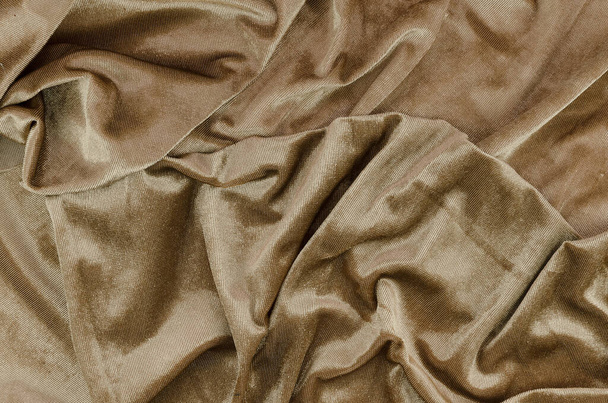 Bovenaanzicht rommelige gouden bedlakens gerimpelde stof textuur - Foto, afbeelding