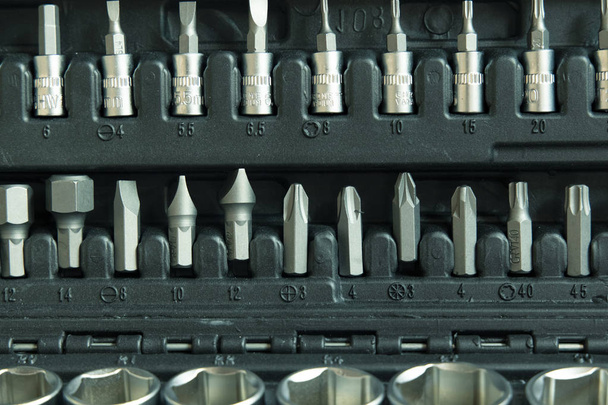 repair tool kit box background with screwdriver bits from stainless steel industrial material  - Foto, imagen