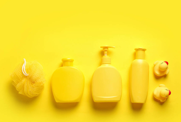 Flat lay composition with baby cosmetic products on yellow background - Фото, изображение