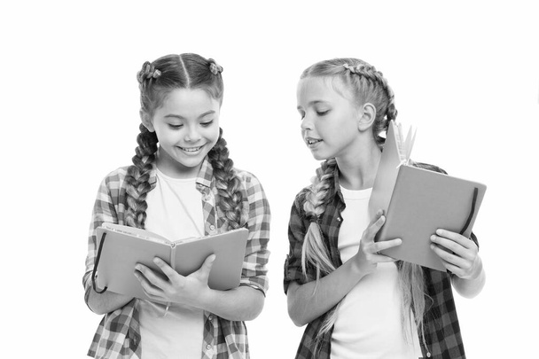 Reading skills. Cute small children holding books. Adorable little girls with school exercise books. Preparing activity books for writing. Study language. Achieve knowledge. Education concept - Fotoğraf, Görsel