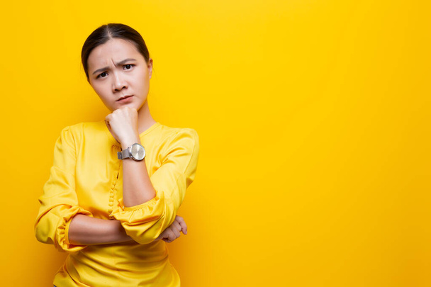 Woman feel confused isolated over yellow background - Zdjęcie, obraz