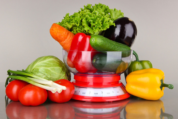 Fresh vegetables in scales on gray background - Zdjęcie, obraz
