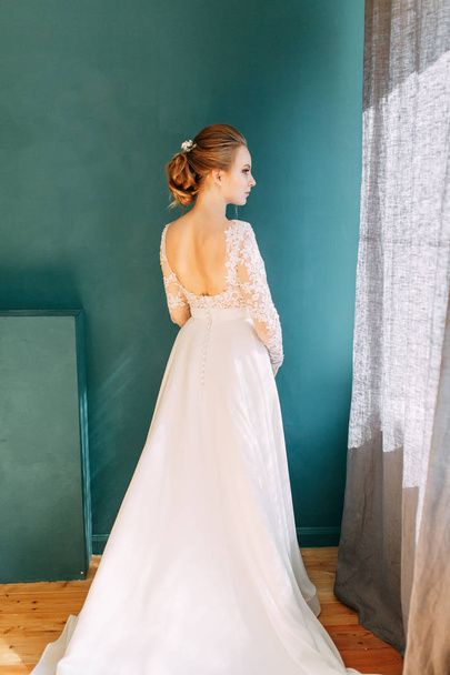 European-style wedding at the hotel. Bride in a white dress in the interior Studio.  - Fotoğraf, Görsel