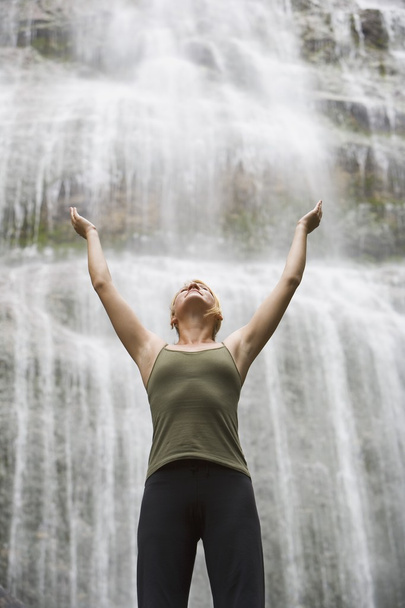 Woman With Arms Raised In Front Of Waterfall - Foto, Imagem