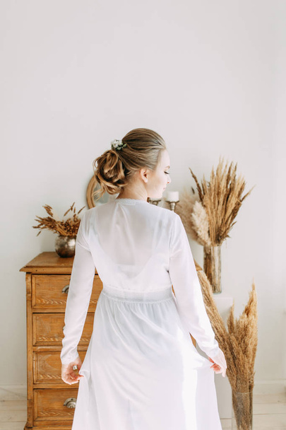 Girl in boudoir dress in European style. Morning bride in the interior Studio.  - Fotoğraf, Görsel