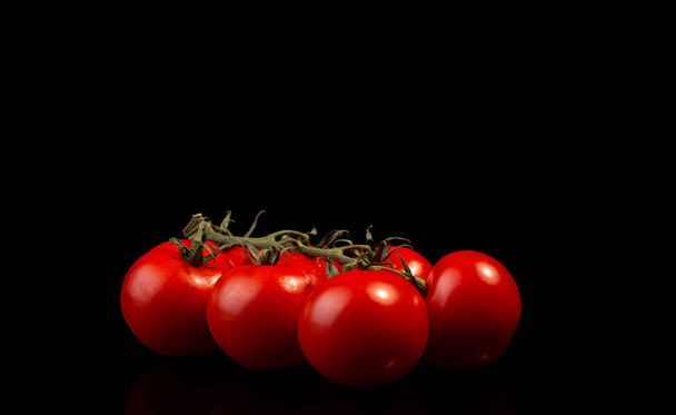 cherry tomatoes on black background - Foto, Imagem