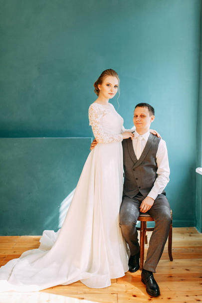 Modern ceremony in European style. Beautiful wedding couple in a bright Studio.  - 写真・画像