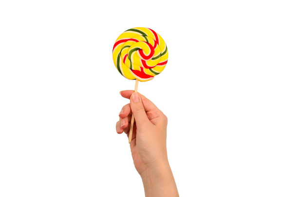 Lollipop in female hand isolated on white  background. Space for - Photo, image