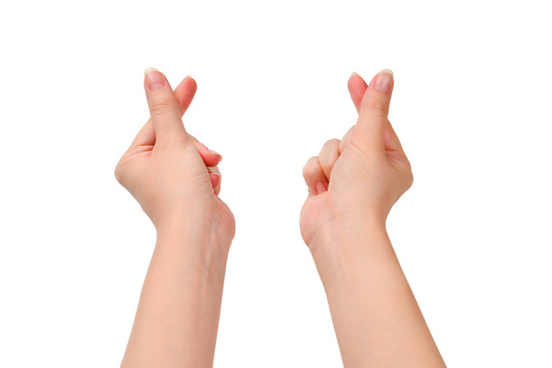 Γυναικεία χέρια απομονωμένα στο λευκό. Σύμβολο καρδιάς. - Φωτογραφία, εικόνα