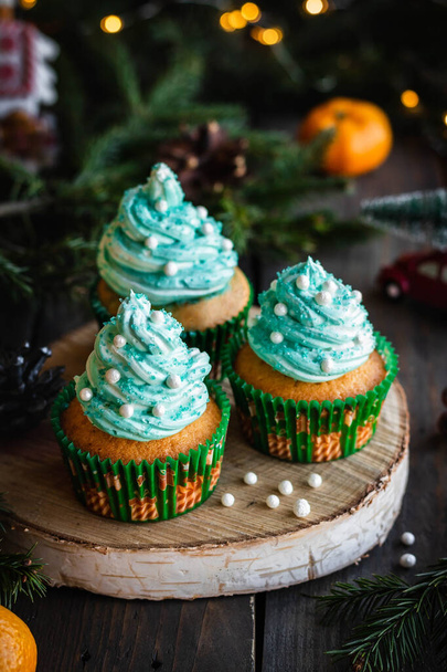 Citrus cupcakes with butter cream and festive decor for New Year and Christmas. - Photo, Image