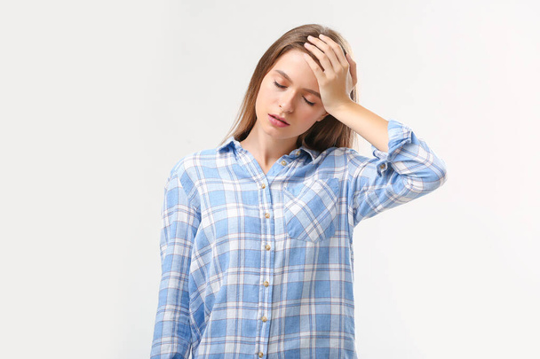 Stressed young woman on white background - Photo, Image