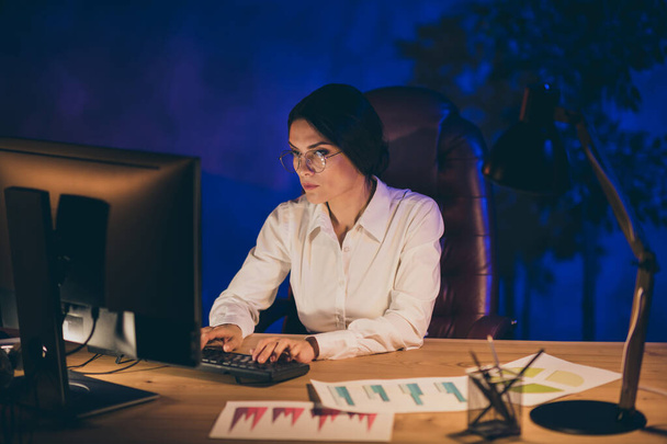 Portrait of her she nice attractive chic smart clever intellectual lady top executive manager ceo boss chief professor preparing audit result deadline annual report at night dark work place station - Photo, image